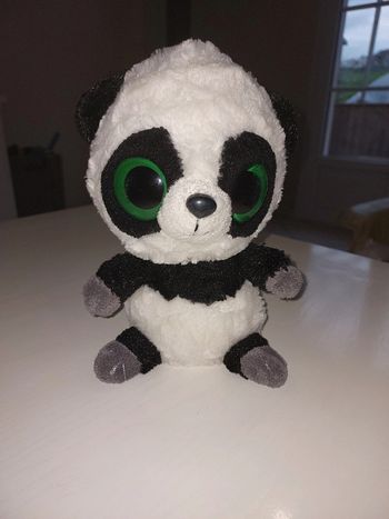 Peluche Panda aux grands yeux verts