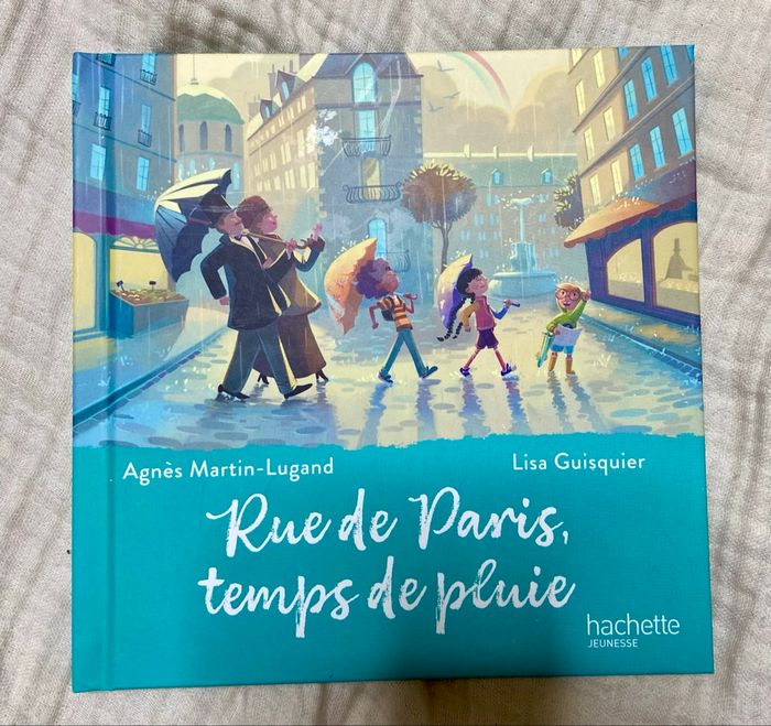 Livre rue de Paris temps de pluie mc do bon état - photo numéro 2