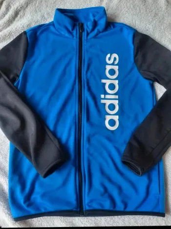Veste jogging Adidas à zip bleu et noire 11/12 ans