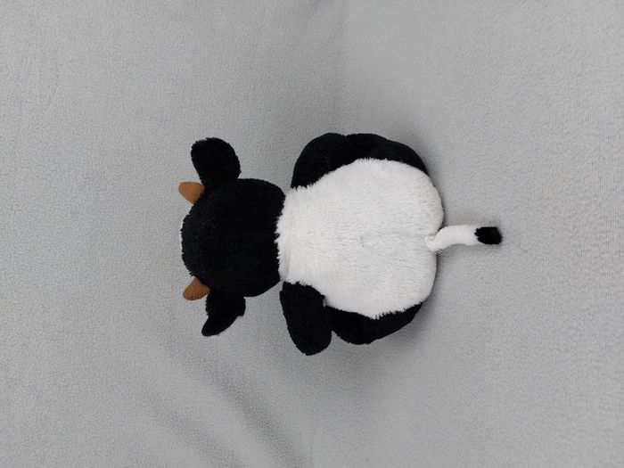 Peluche doudou vache blanc noir marron 23 cm assis yeux durs - photo numéro 2