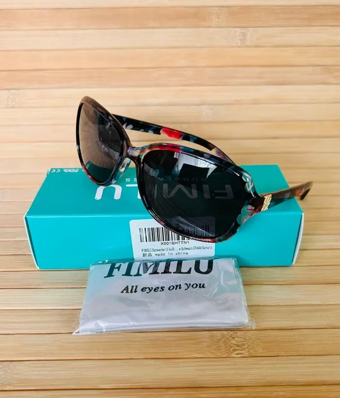 Paire de lunettes de soleil Fimilu multicolores. P*61-4
