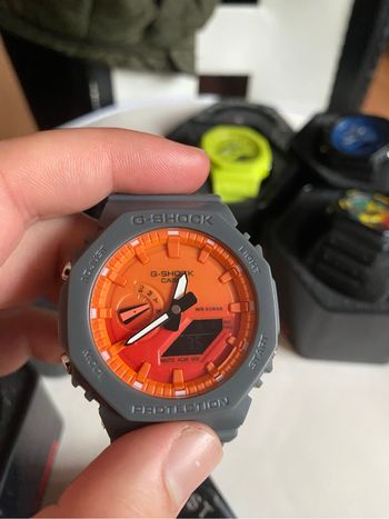 Montre G Shock gris orange