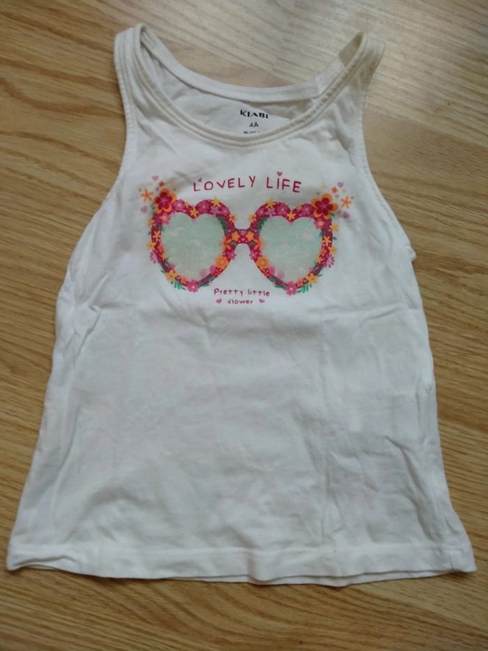 Débardeur blanc. Lunettes a paillettes. Filles. Kiabi
Taille 4 ans - photo numéro 2