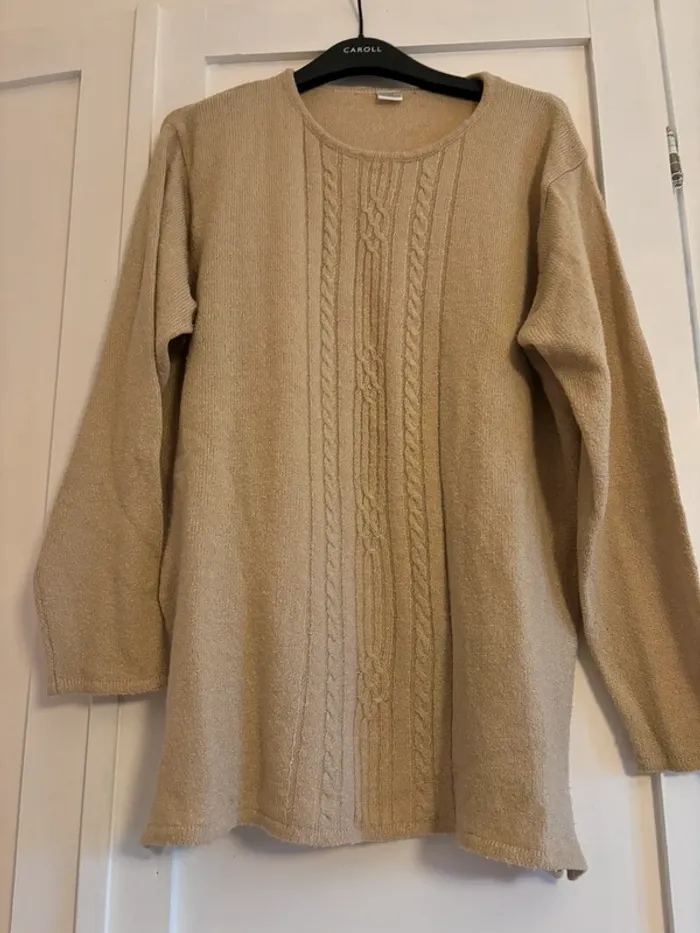 Pull beige à torsades