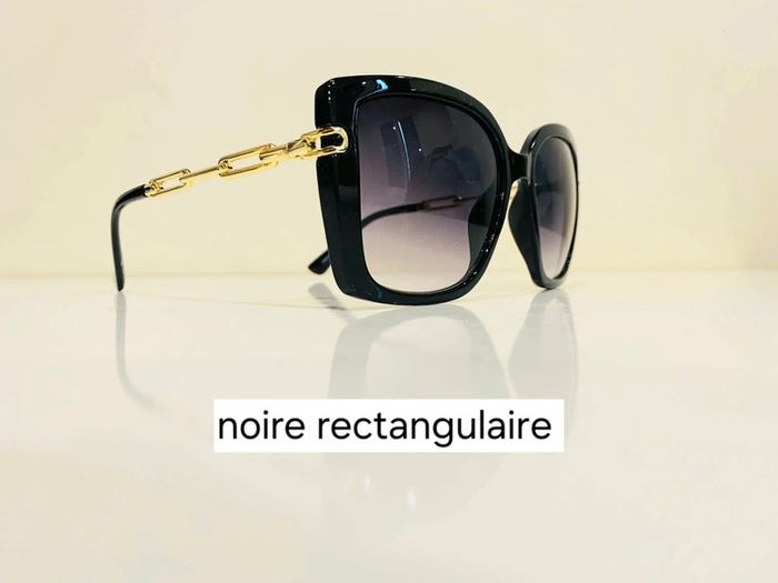 Lunette de soleil femme noire rectangulaire bras en chaîne dorée UV protection catégorie 3