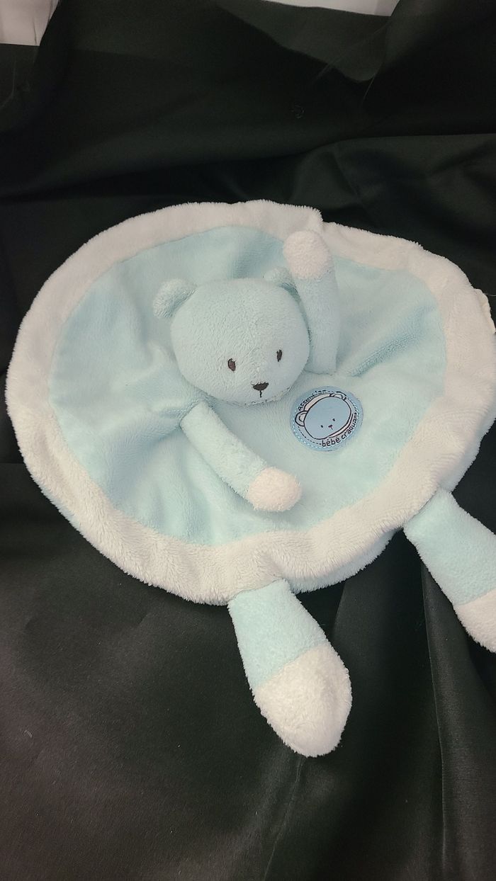 Doudou plat rond Ours bleu blanc Attention bébé craquant La Halle