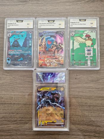 Lots de cartes Pokémon gradées.