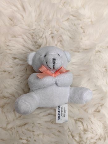 Peluche ours blanc noeud rose Chaussea Expo