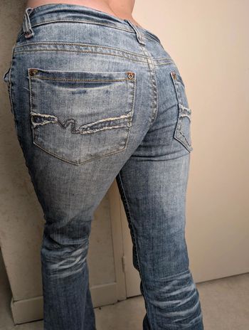 Jean taille basse patte d'éléphant stylé délavé