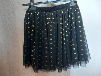 Jolie jupe noire à motifs cœur dorés 9-10ans