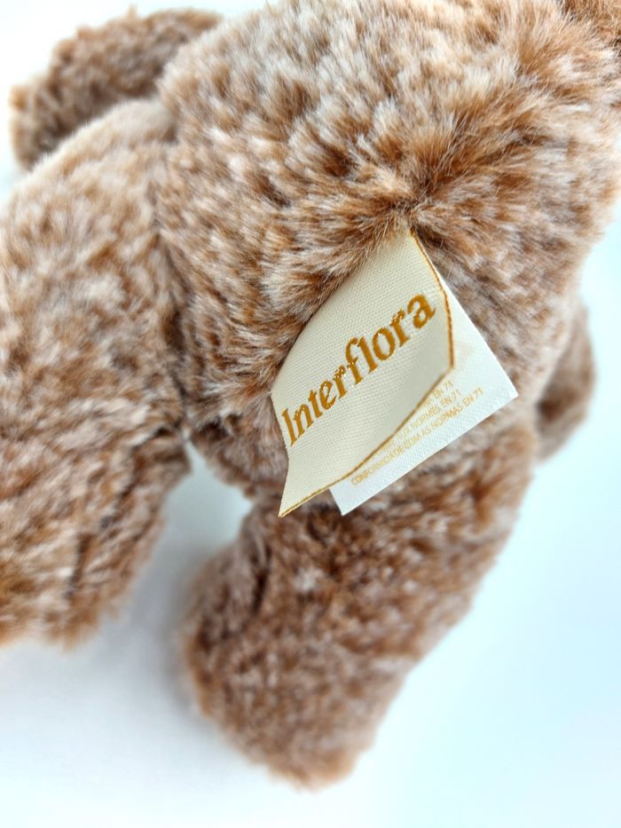 Peluche doudou ours marron chiné beige INTERFLORA Famosa 2019 20 cm nœud carreaux état neuf - photo numéro 3