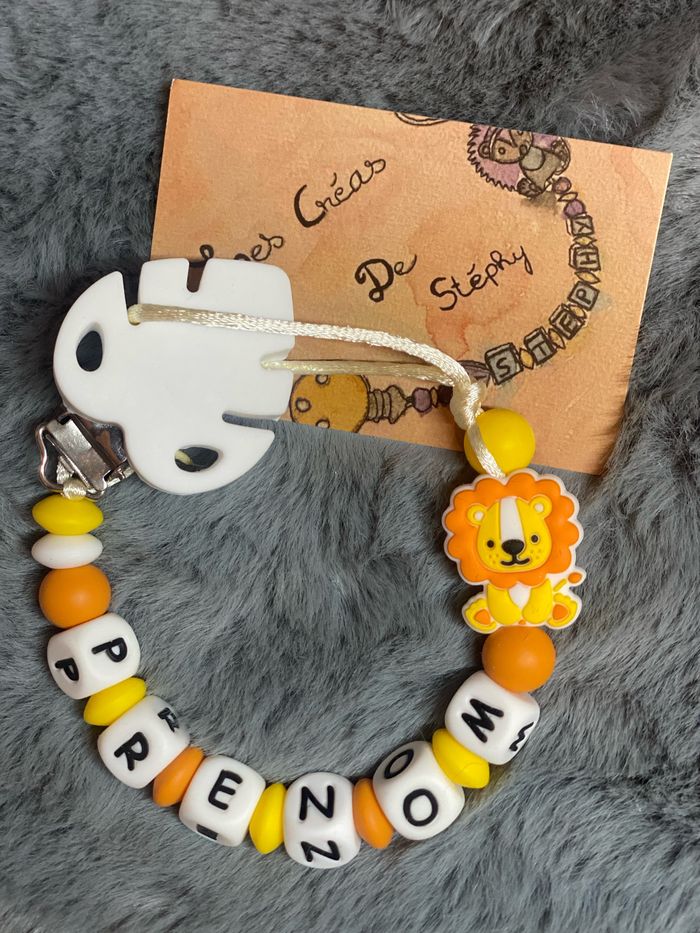 Attache tétine lion