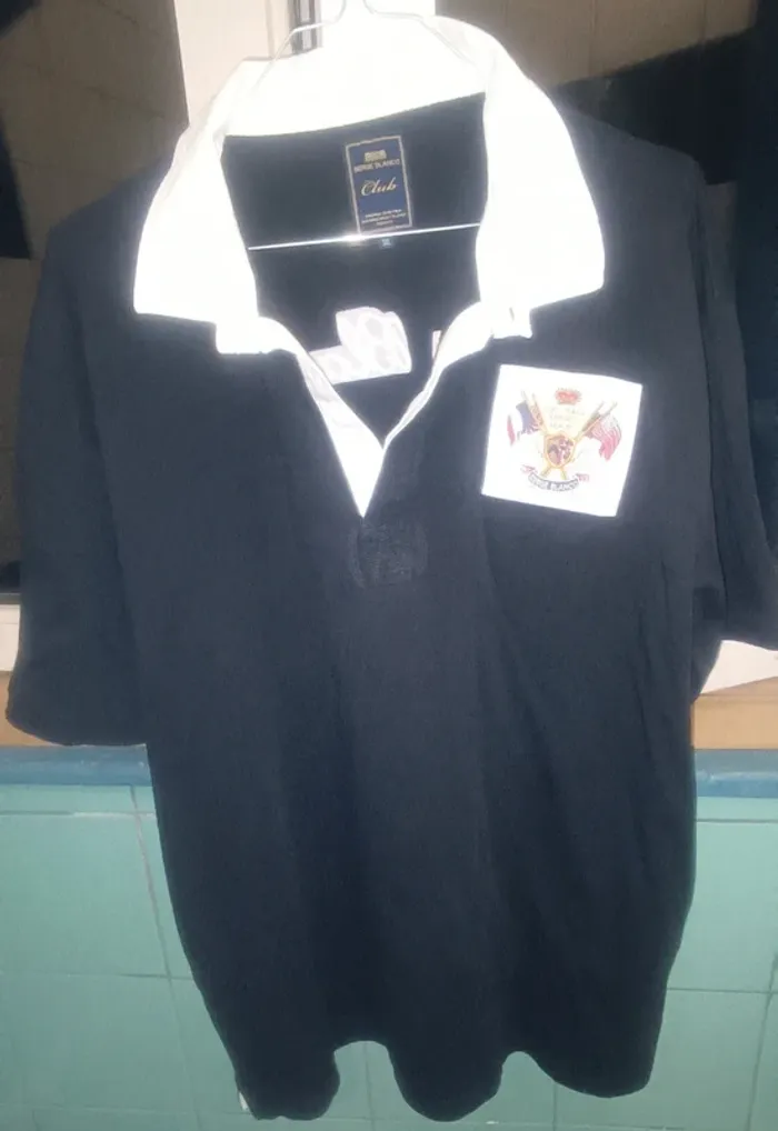 Polo noir col blanc Serge Blanco
