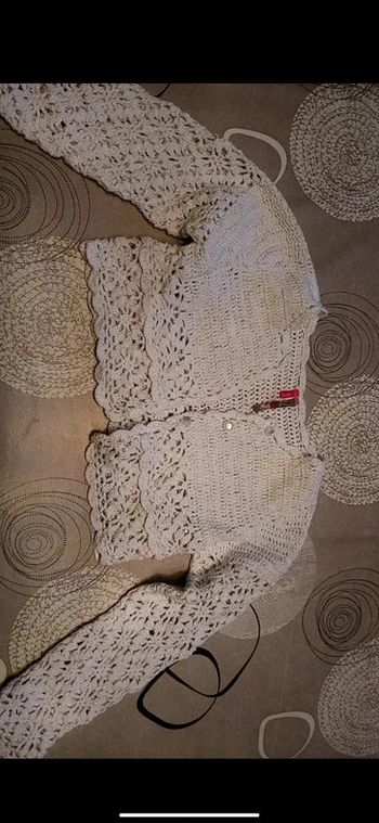 Gilet (Boléro) orchestra blanc pailletté fille 4 ans en très bon état.