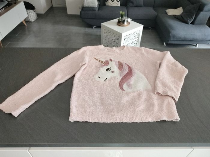 Pull rose taille 12 ans