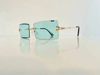 Lunette de soleil mixte percée verres verts uvprotection catégorie 2