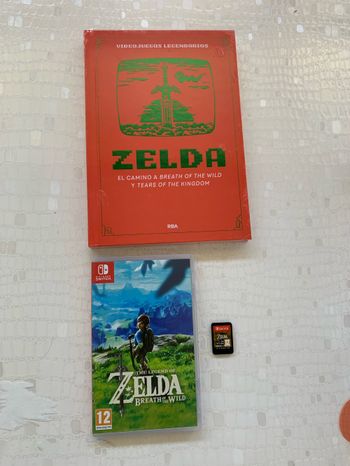 Jeu switch Zelda breath of the wild + livre
