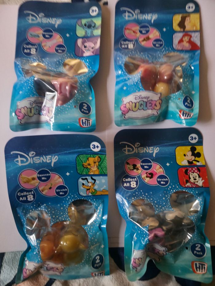 Lot de 4 packets de disney snuglets à collectionner