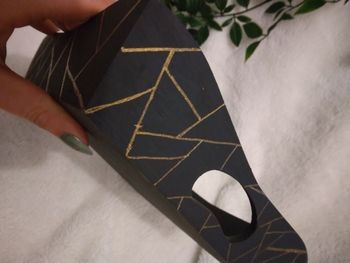 Vide poche noir et dorée