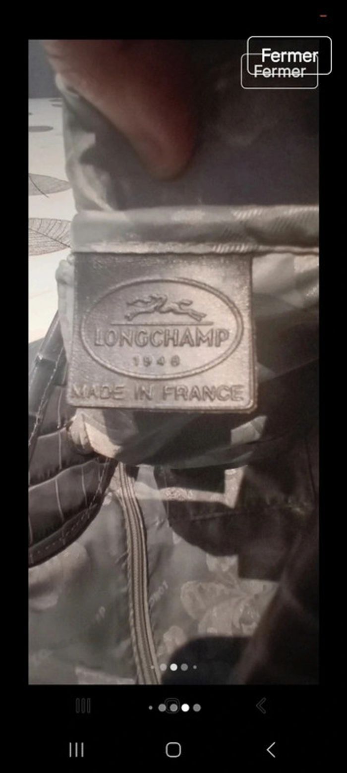 Sac longchamp grande capacité en porte épaule en cuir croco l état du sac en photo 
26x37x12 - photo numéro 12