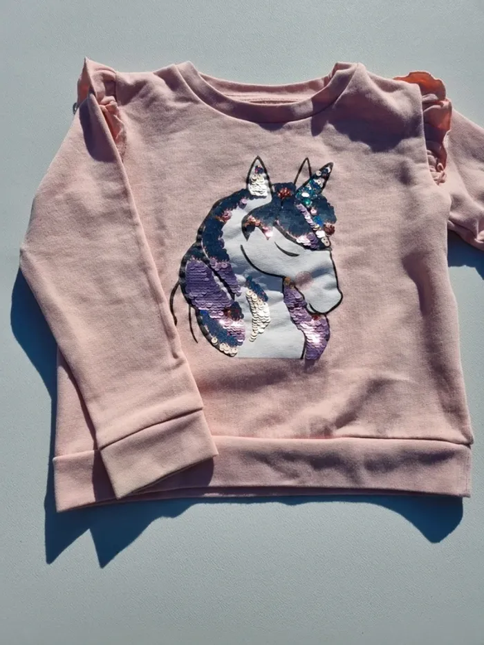 Pull sequins licorne