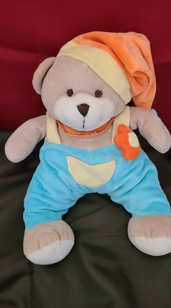 Peluche doudou Musical Ours bleu orange fleur Althans club 30 cm