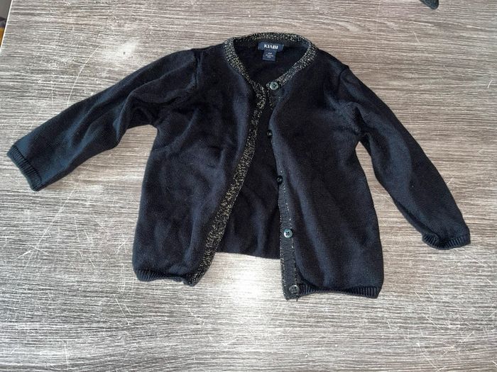 Gilet noir et doré