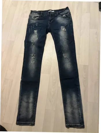Jean skinny bleu effet destroy 38 miss Anna très bon état