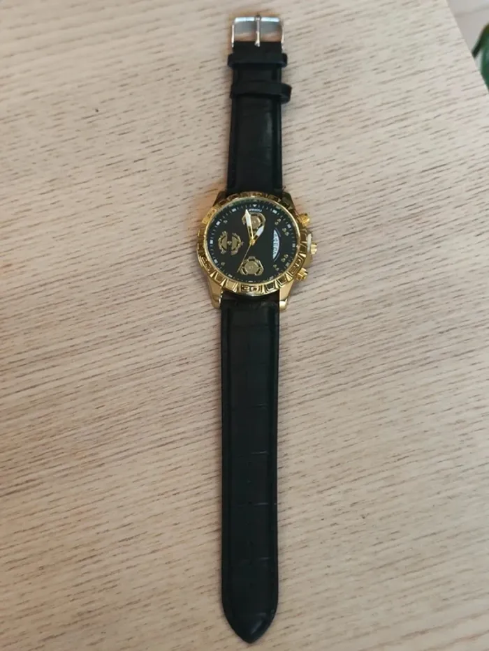 Montre homme noire, dorée, style mécanique - photo numéro 3