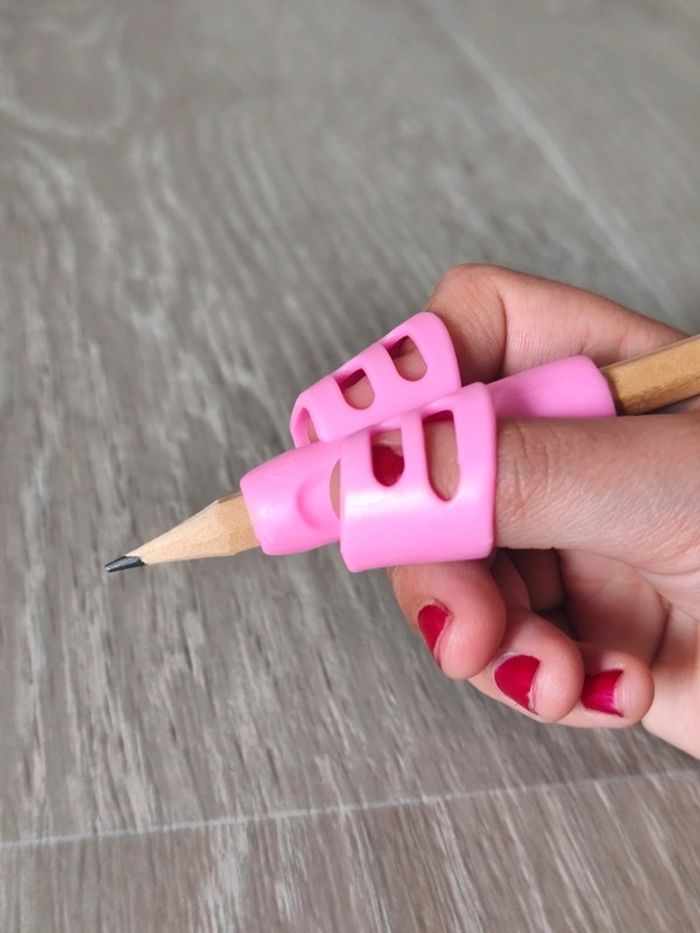 Correcteur de posture d'écriture en silicone souple rose