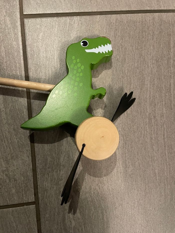 Jouet à pousser en bois Dinosaure