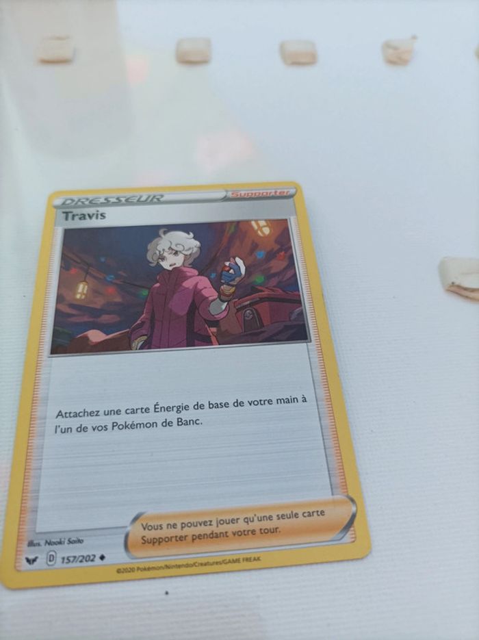 Carte pokémon Travis dresseur supporter