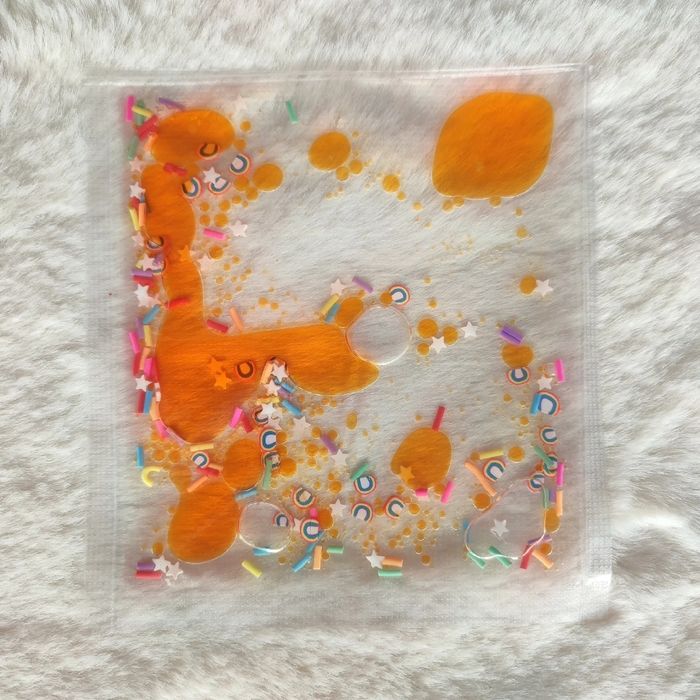 Pochette sensorielle orange arc en ciel 🌈