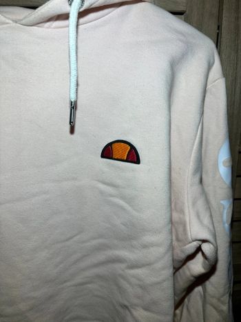 Sweat a capuche court Ellesse rose clair avec écriture Taille M
