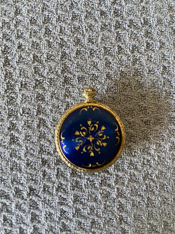 Montre/pendentif dorée vintage 