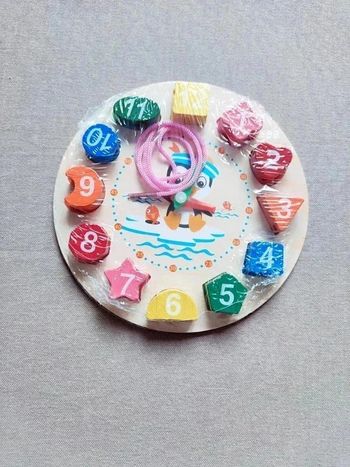 Horloge d'apprentissage en bois - multicolore