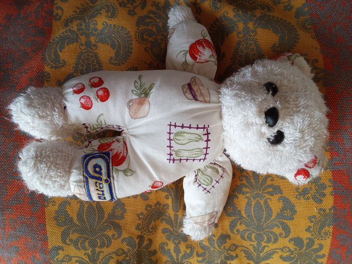 Doudou Ajena ours ourson blanc tissu bouclettes éponge corps imprimé fruit chapeau