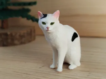 Figurine chat blanc et noir assis Animal domestique