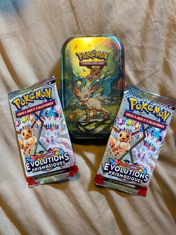 Lot Mini tin phyllali + 2 boosters EV8.5 évolutions prismatiques