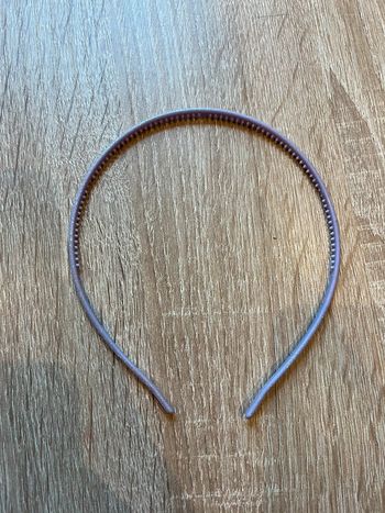 Serre-tête mauve pailleté neuf 0,50 centimes