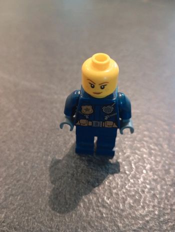 Police-helicopter pilot female- gold badge and utilit.