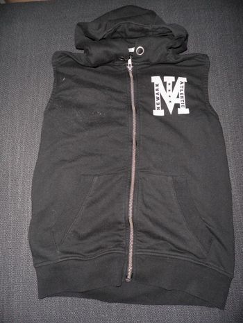 veste noire sans manches 10 ans