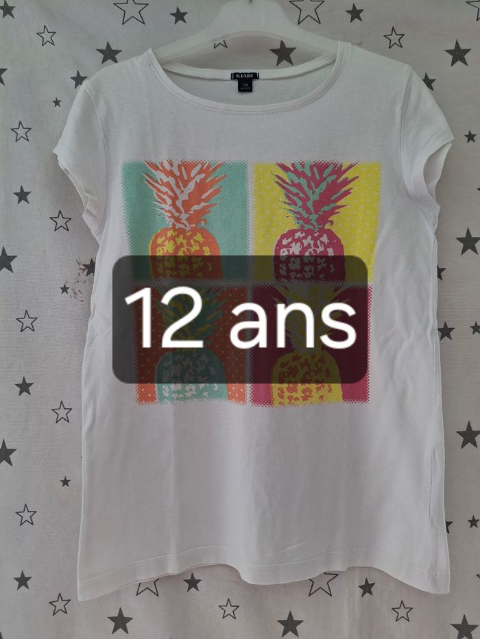 Tee-shirt blanc avec ananas 12 ans Kiabi 
 bon état ni trous ni tache