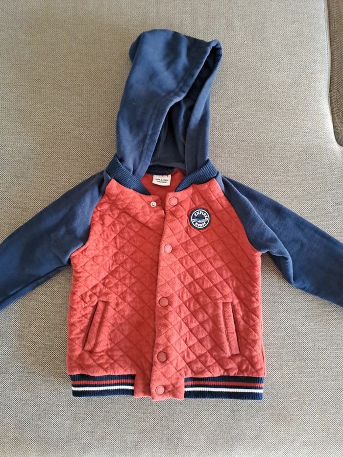 Veste à pression capuche