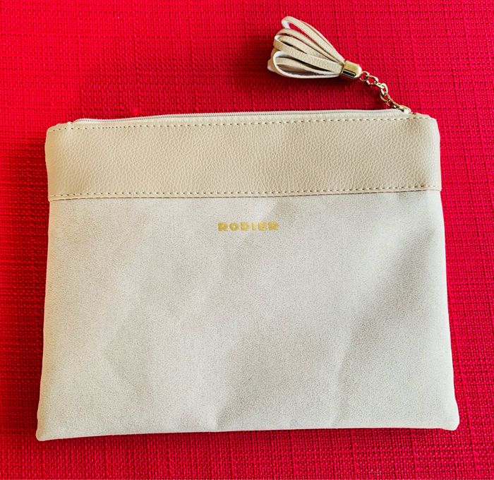 Trousse pochette beige ecru avec pompon Rodier Damart