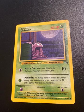 Grimer 48/62 1st Edition Fossil
