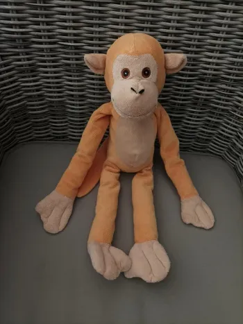 Jolie peluche singe pouvant s accrocher