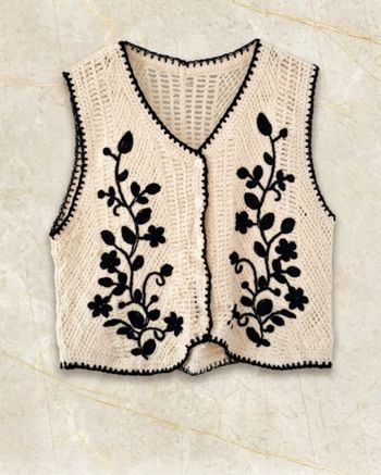 Veste sans manches motifs fleurs mailles ajourees