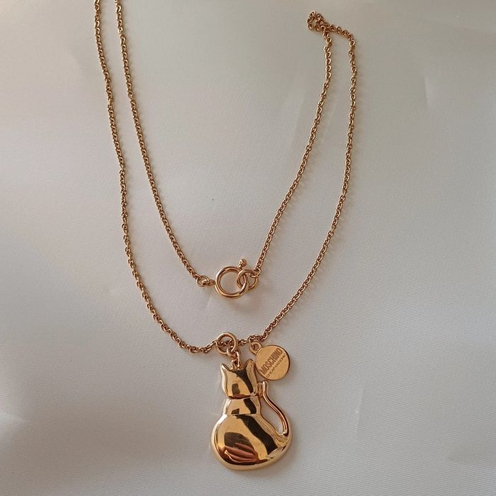 Collier moshino en métal doré