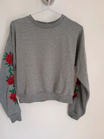 Pull fleur manche